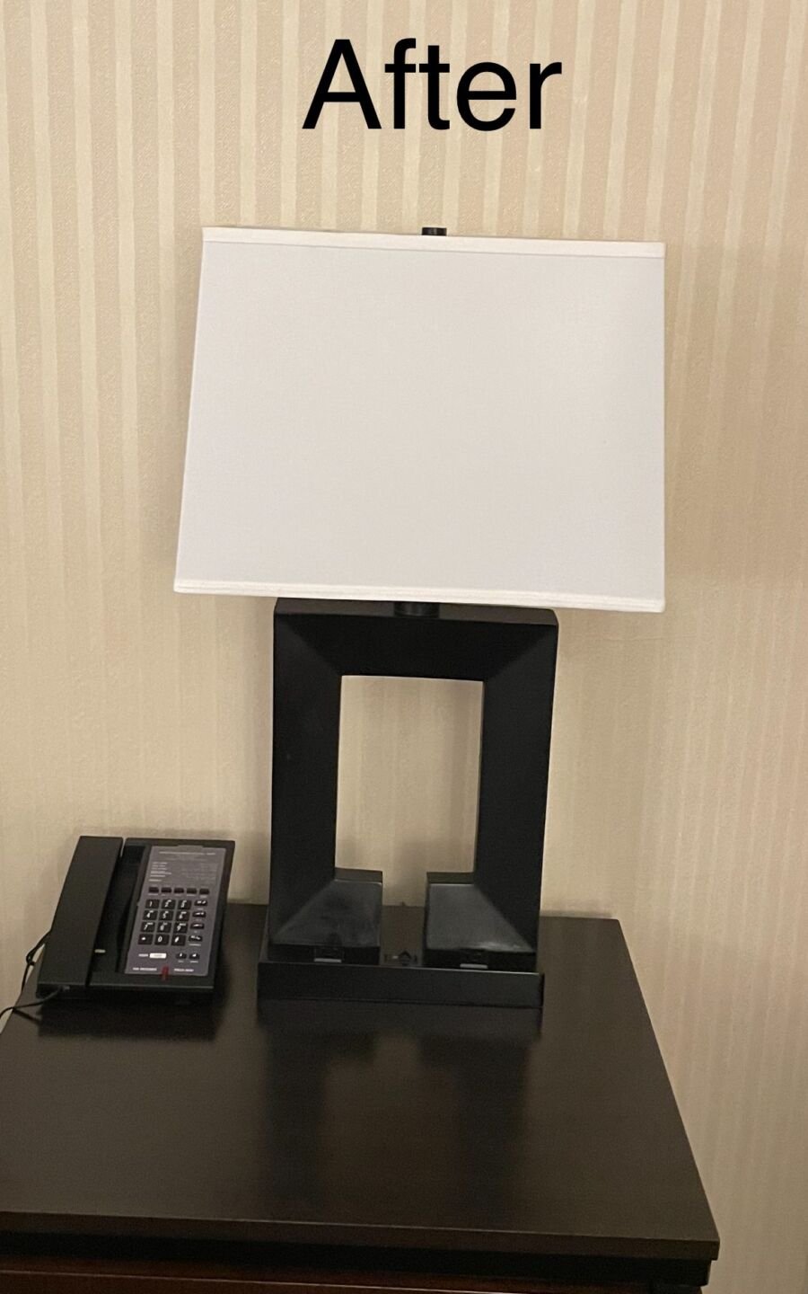 Hotel guest-room table lamp with a new white rectangular lampshade