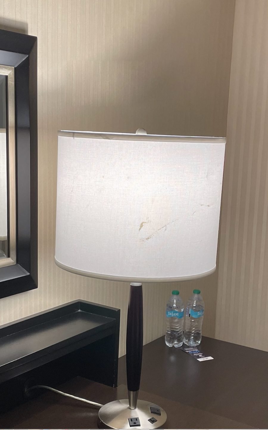 Hotel bedside lamp with an old drum lampshade